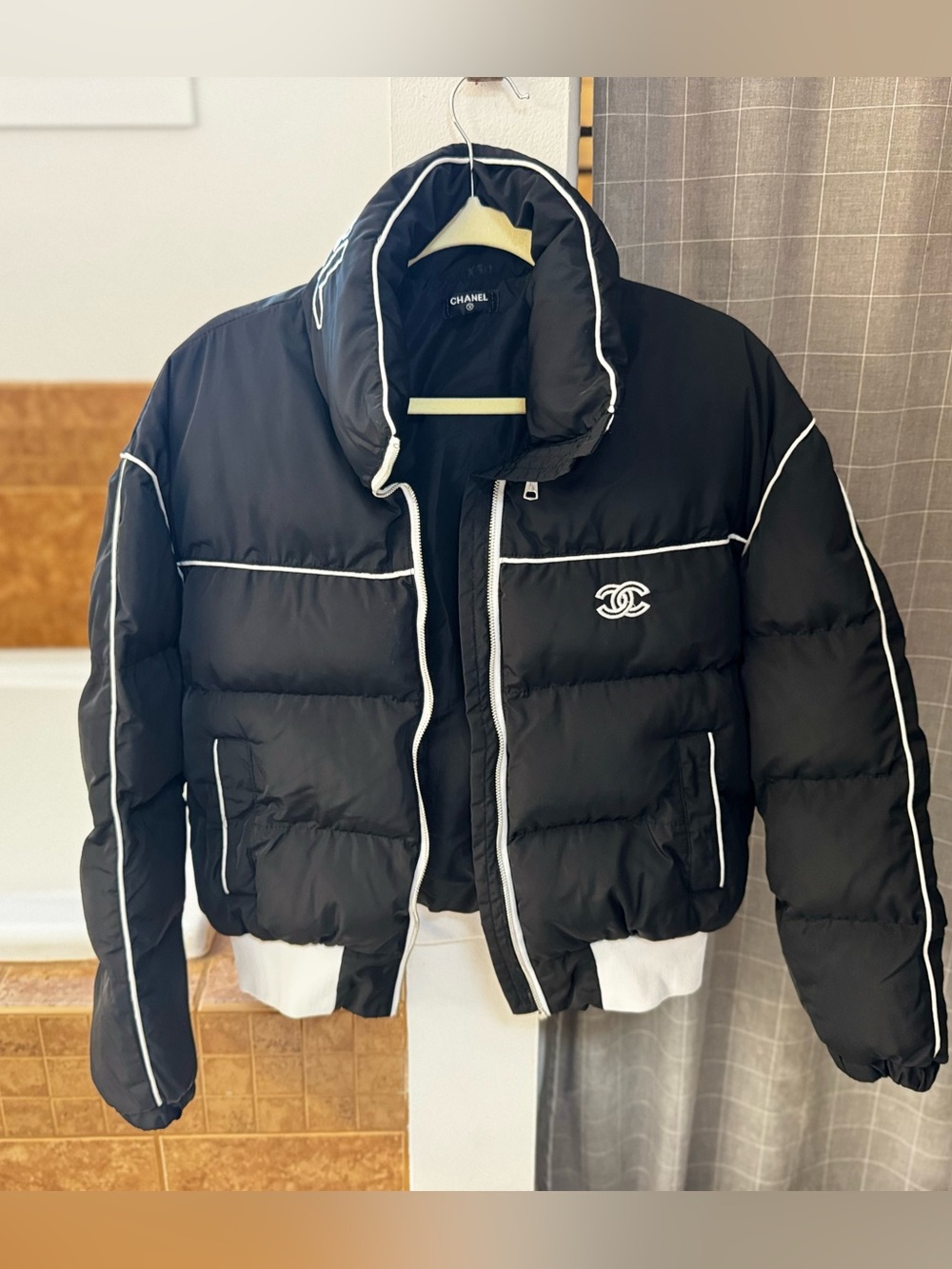 CHANEL Black Puffer Jacket with White Piping